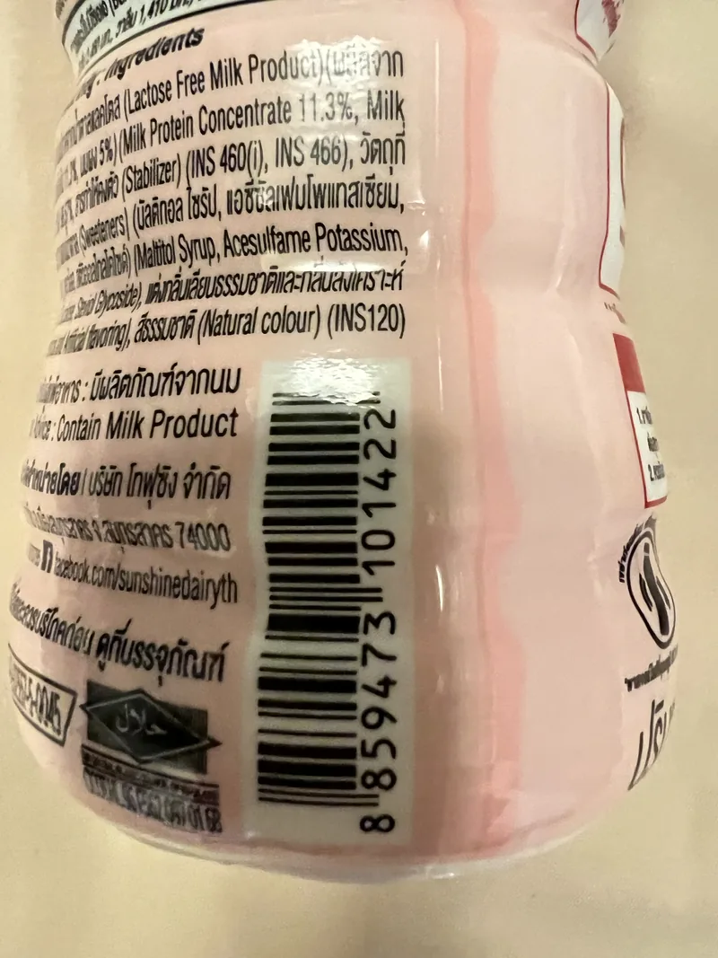 Side of the Sunshine Dairy bottle showing English ingredients and barcode 8859473101422