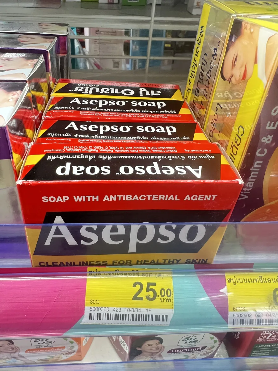 Asepso antibacterial bar soap in red and black packaging on a Phuket 7-Eleven shelf
